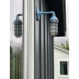 Industrial Guard Sconce, 715-Delphite Blue PTMP, CGG-STandard Cast Guard in 975-Galvanized, Frosted Glass | Photo Courtesy of Studio Baron