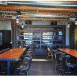 Brewster LED Pendant, 710-Cobalt Blue PTMP, Ribbed Glass, SBK-Standard Black Cord, 2700K Color Temperature | Photo Courtesy of Boneyard Saloon in Park City, Utah (@boneyardsaloon)