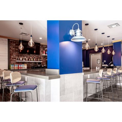 14” Laramie LED Sconce, 975-Galvanized, 1250 Lumen LED, 4000K-Cool White, Flat LED Lens (Also Pictured: Downtown Minimalist Cord Pendants in 705-Navy) | Photo Courtesy of IQ Designs