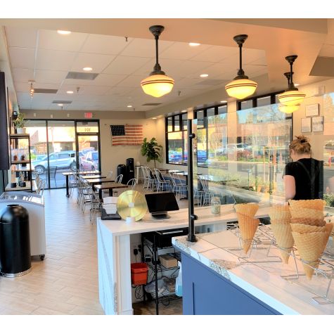 Primary LED Schoolhouse Stem Mount Light, 105-Textured Black, Large Opaque Glass, 24” Stem, Double Painted Band in 100-Black, 1250 Lumen LED, 2700K Color Temperature | Photo Courtesy of Ampersand Ice Cream