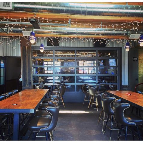 Brewster LED Pendant, 710-Cobalt Blue PTMP, Ribbed Glass, SBK-Standard Black Cord, 2700K Color Temperature | Photo Courtesy of Boneyard Saloon in Park City, Utah (@boneyardsaloon)