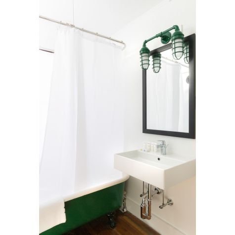 Double Market Industrial Guard Sconce, 307-Emerald, No Shade, CGG-Standard Cast Guard, FST-Frosted Guard | Photo Courtesy of Rachel Reider Interiors